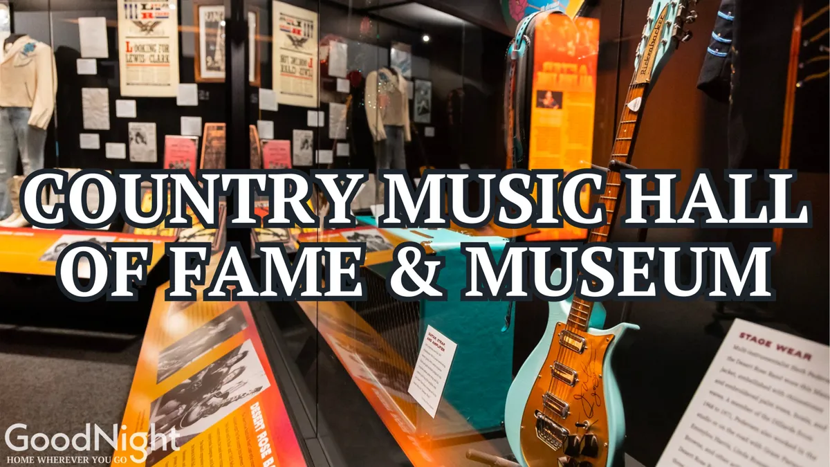 The interior of the Country Music Hall of Fame exhibits, featuring iconic memorabilia such as guitars, stage wear, and engaging informational displays. Visitors appear to be interacting with the exhibits, capturing the sense of discovery and cultural immersion.